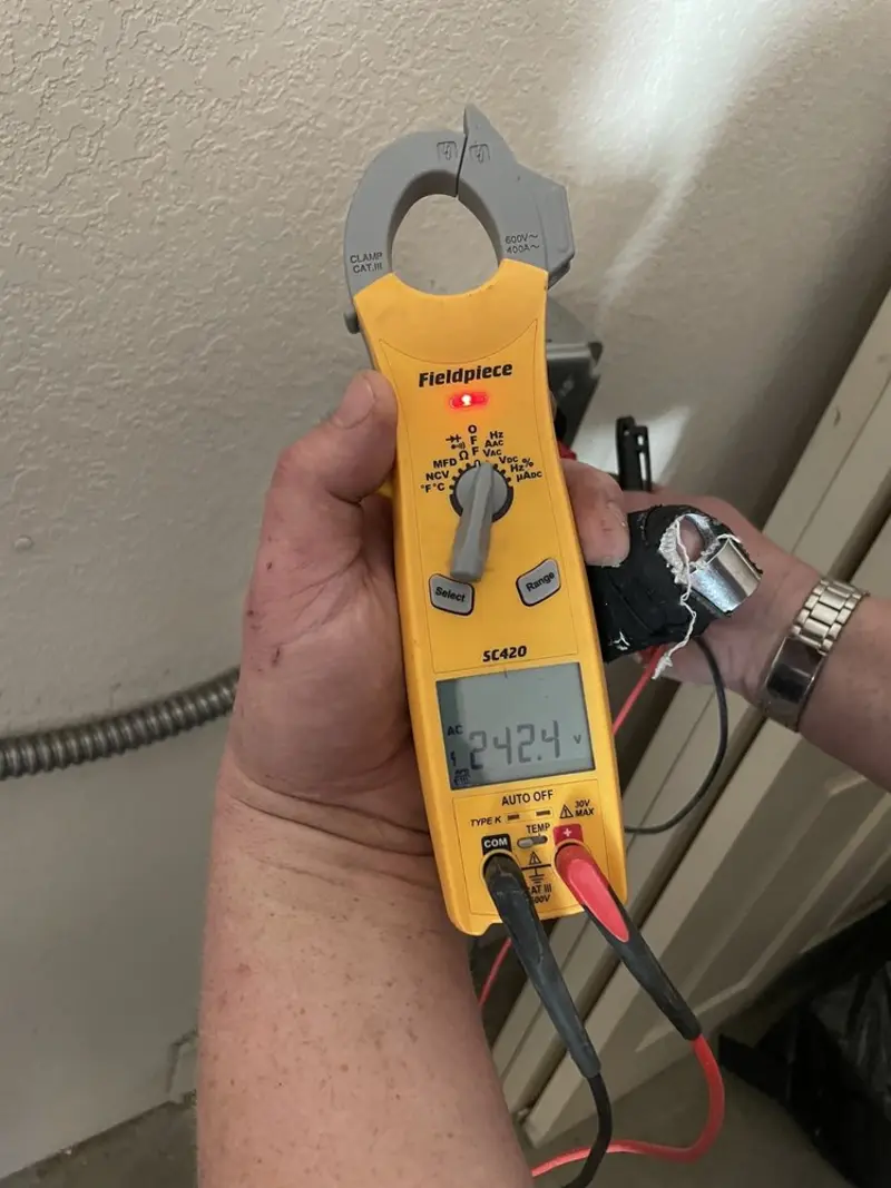 Voltage testing with clamp meter during Recessed Lighting Installation in Rosenberg